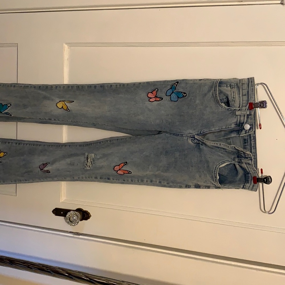 Jeans with butterfly patches